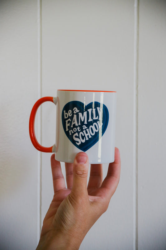 Be A Family Not A School Mug