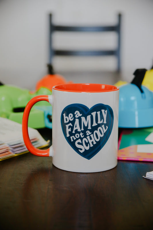 Be A Family Not A School Mug